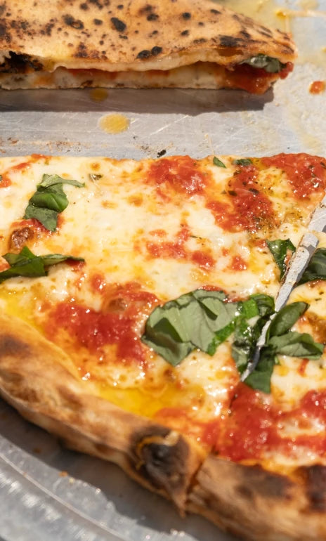 Vincenzo's pizza slice - @eatkickfoods Instagram